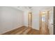 Bright bedroom featuring hardwood floors and a doorway at 8823 White Sage Loop # 1802, Lakewood Ranch, FL 34202
