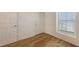 Bedroom featuring hardwood floors, and a window at 8823 White Sage Loop # 1802, Lakewood Ranch, FL 34202