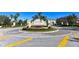 Welcome to this community, marked by a beautiful entrance sign and colorful floral arrangements at 8823 White Sage Loop # 1802, Lakewood Ranch, FL 34202