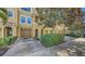Beautiful townhome with attached garage, stucco facade, and a well-manicured yard at 8823 White Sage Loop # 1802, Lakewood Ranch, FL 34202