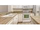 Well-lit kitchen area featuring white appliances and a double basin sink at 8823 White Sage Loop # 1802, Lakewood Ranch, FL 34202