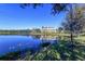 A picturesque pond with a community building reflecting in the calm water at 8823 White Sage Loop # 1802, Lakewood Ranch, FL 34202