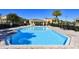 A large, inviting swimming pool, perfect for relaxation and recreation in a community setting at 8823 White Sage Loop # 1802, Lakewood Ranch, FL 34202