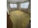 Cozy bedroom featuring natural light from the windows and neutral walls at 9950 62Nd N Ter # 401, St Petersburg, FL 33708