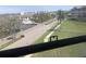 View of street, buildings and landscaping from condo window at 9950 62Nd N Ter # 401, St Petersburg, FL 33708