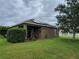 Home featuring solar panels, covered patio and a large backyard, blending comfort and sustainability at 2819 47Th E St, Palmetto, FL 34221