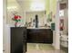 Bathroom featuring double sinks, a glass-enclosed shower, and neutral tile at 2819 47Th E St, Palmetto, FL 34221