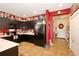 Well-lit kitchen featuring dark cabinetry and modern appliances, accented by vibrant red walls at 2819 47Th E St, Palmetto, FL 34221