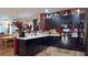 Charming kitchen with dark cabinets, white countertops, and a stylish floral rug at 2819 47Th E St, Palmetto, FL 34221