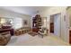 Cozy living room with neutral tones, decorative furniture, and natural light from the window at 2819 47Th E St, Palmetto, FL 34221