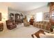 Spacious living room with plush seating, decorative shelving, and natural light streaming through the windows at 2819 47Th E St, Palmetto, FL 34221