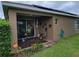 Inviting covered patio with comfortable seating, ideal for outdoor dining and entertaining guests at 2819 47Th E St, Palmetto, FL 34221