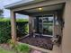 Cozy covered patio with outdoor seating, perfect for relaxing and enjoying the peaceful surroundings at 2819 47Th E St, Palmetto, FL 34221