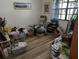 Untidy bedroom with natural light and wood-look flooring at 5231 Brassy Loop, North Port, FL 34287