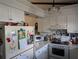 Functional kitchen featuring white appliances, ample countertop space, and white cabinets at 5231 Brassy Loop, North Port, FL 34287