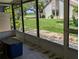 Enclosed patio with views of the manicured lawn and community at 5231 Brassy Loop, North Port, FL 34287