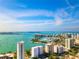 Scenic aerial view of bay area, waterfront condos, and clear blue sky at 8697 Milestone Dr, Sarasota, FL 34238
