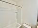 Bright bathroom featuring a shower-tub combination with white tile and a modern toilet at 8697 Milestone Dr, Sarasota, FL 34238