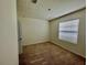 Bright bedroom with carpet, window with blinds, and door to create a cozy retreat at 8697 Milestone Dr, Sarasota, FL 34238