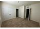 Bedroom with carpet, closet, and neutral walls creating a serene and inviting space at 8697 Milestone Dr, Sarasota, FL 34238
