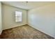 Inviting bedroom with carpet, window and neutral walls creating a relaxing atmosphere at 8697 Milestone Dr, Sarasota, FL 34238