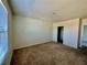 Empty bedroom with neutral walls, plush carpet, walk-in closet and a window for natural light at 8697 Milestone Dr, Sarasota, FL 34238