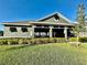 Community clubhouse with well-maintained lawn and landscaping, a great gathering spot at 8697 Milestone Dr, Sarasota, FL 34238