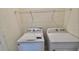 Functional laundry area equipped with a washer and dryer, ready for your convenience at 8697 Milestone Dr, Sarasota, FL 34238