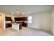 Bright, open concept living space with stainless steel appliances and tile flooring at 8697 Milestone Dr, Sarasota, FL 34238