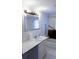 Bathroom featuring a white sink and a shower with a grab bar at 126 W North St, Tampa, FL 33604