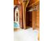 Walk-in closet with an open door and wood-paneled walls at 126 W North St, Tampa, FL 33604