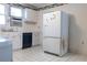 A kitchen featuring white cabinets, tiled countertops, tiled floor, and appliances at 126 W North St, Tampa, FL 33604
