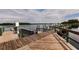 Large wooden community dock with multiple boat slips and calm water views at 2073 Treasure Ln, Punta Gorda, FL 33982