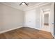 Bright bedroom featuring hardwood floors and double door closet at 2073 Treasure Ln, Punta Gorda, FL 33982