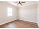 Bright bedroom with hardwood floors and a large window at 2073 Treasure Ln, Punta Gorda, FL 33982