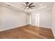 Spacious bedroom with hardwood floors and ceiling fan at 2073 Treasure Ln, Punta Gorda, FL 33982