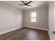 Spacious bedroom with hardwood floors and a large window, offering ample natural light at 2073 Treasure Ln, Punta Gorda, FL 33982