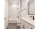 Modern bathroom with white subway tile, freestanding tub, and gray floor tiles at 2073 Treasure Ln, Punta Gorda, FL 33982