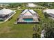Aerial view of a home with a pool and lush landscaping at 2073 Treasure Ln, Punta Gorda, FL 33982