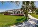 Spacious backyard with pool and lush landscaping at 2073 Treasure Ln, Punta Gorda, FL 33982