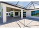 Covered patio with paver stones, ceiling fan, and access to pool area at 2073 Treasure Ln, Punta Gorda, FL 33982