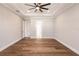 Large bedroom with hardwood floors and ceiling fan at 2073 Treasure Ln, Punta Gorda, FL 33982