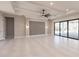 Spacious great room featuring high ceilings, sliding glass doors, and a stylish accent wall at 2073 Treasure Ln, Punta Gorda, FL 33982
