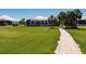 Landscaped backyard with a walkway and home view at 2073 Treasure Ln, Punta Gorda, FL 33982