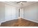 Light and airy bedroom with hardwood floors and access to a bathroom at 2073 Treasure Ln, Punta Gorda, FL 33982