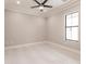 Spacious bedroom with large window and ceiling fan at 2073 Treasure Ln, Punta Gorda, FL 33982