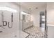 Elegant bathroom with walk-in shower and patterned tile floor at 2073 Treasure Ln, Punta Gorda, FL 33982
