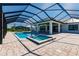 Inviting pool and spa with a screened enclosure at 2073 Treasure Ln, Punta Gorda, FL 33982