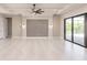 Spacious great room featuring high ceilings, sliding glass doors, and a stylish accent wall at 2073 Treasure Ln, Punta Gorda, FL 33982