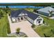Aerial view of waterfront home with modern farmhouse design at 2073 Treasure Ln, Punta Gorda, FL 33982